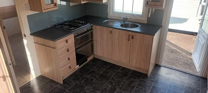 Kitchen with a built-in oven and hob