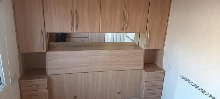 Bedroom with fitted wardrobes and a dressing table