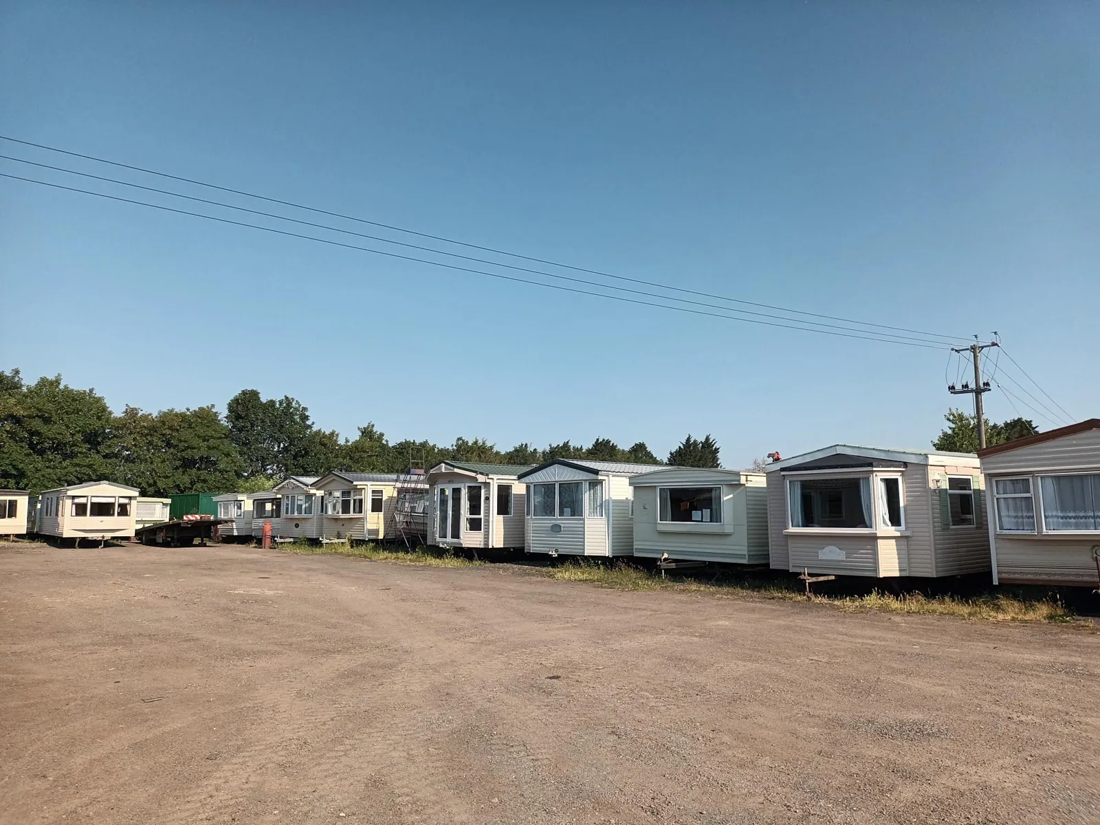 A long row of second hand static caravans in the yard